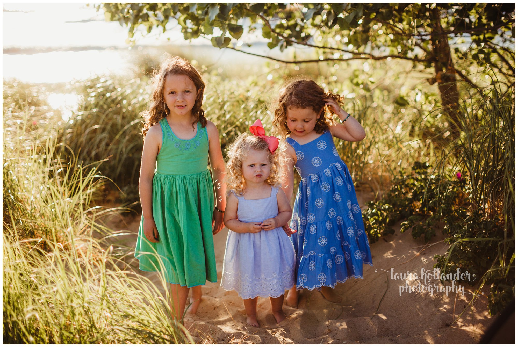 family of five, 3 sisters candid family beach portraits, what to wear beach portraits, Oval Beach Saugatuck, Laura Hollander Photography, west Michigan photographer
