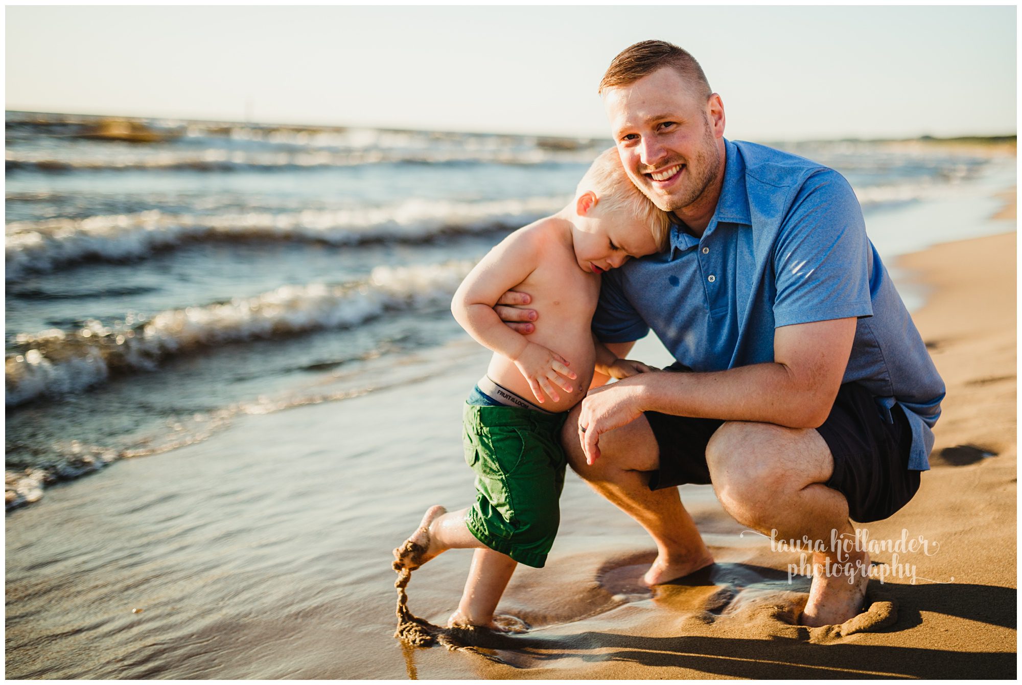 father son photos, father son snuggle on the beach, candid family beach portraits, what to wear beach portraits, Oval Beach Saugatuck, Laura Hollander Photography, west Michigan photographer