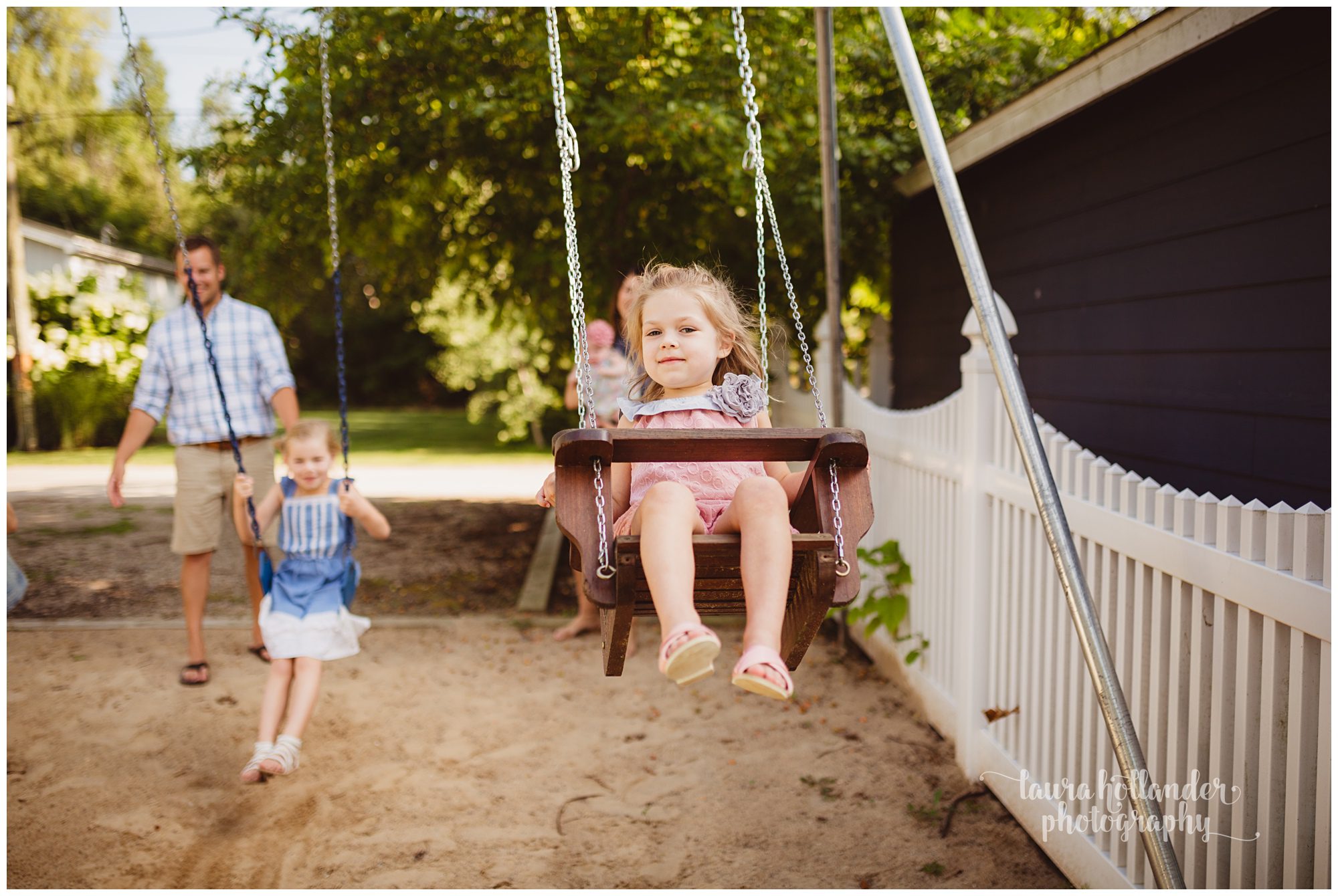 family of 6, four daughters, family portraits on the swing set, Laura Hollander Photography Battle Creek MI