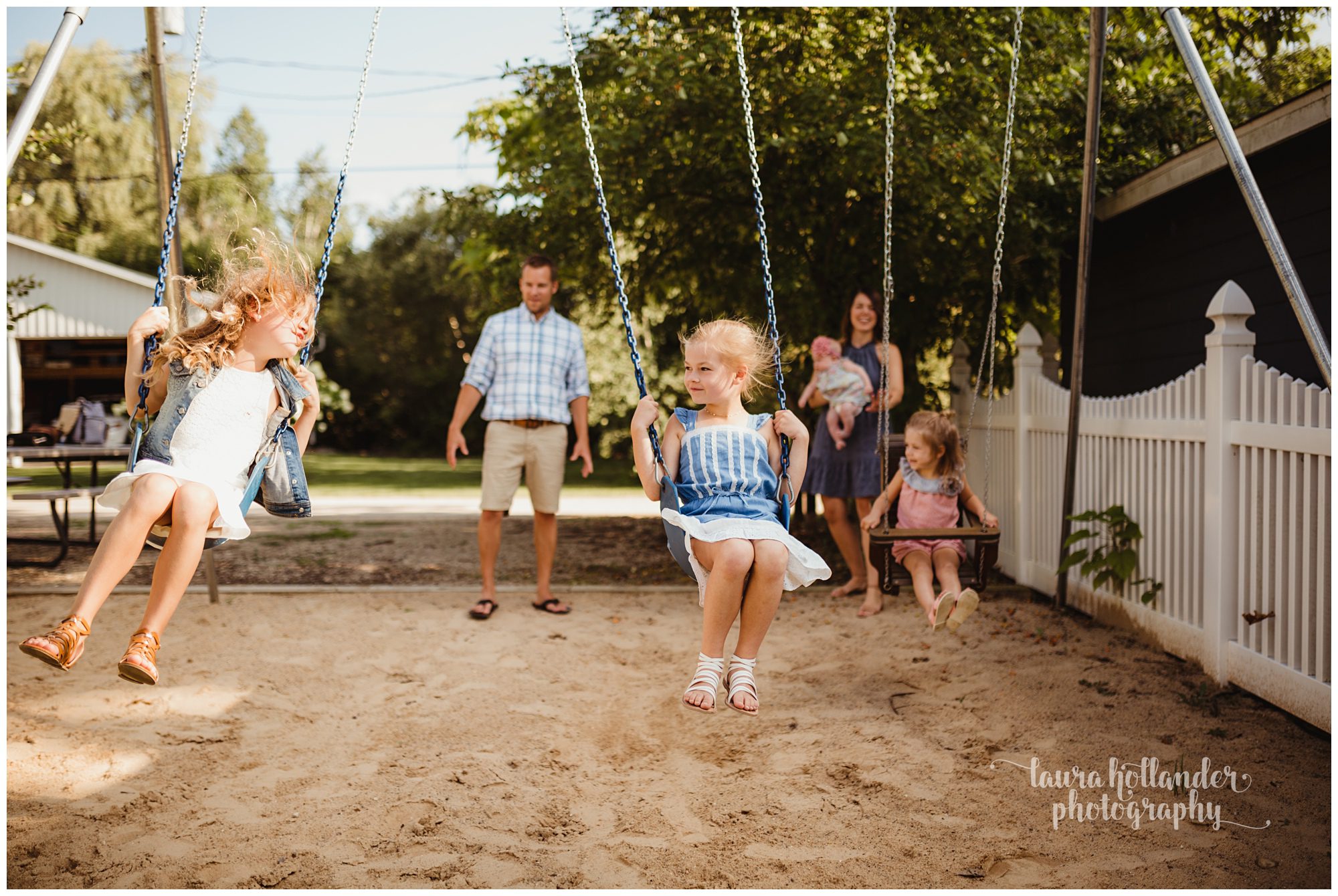 family of 6, four daughters, family portraits on the swing set, Laura Hollander Photography Battle Creek MI