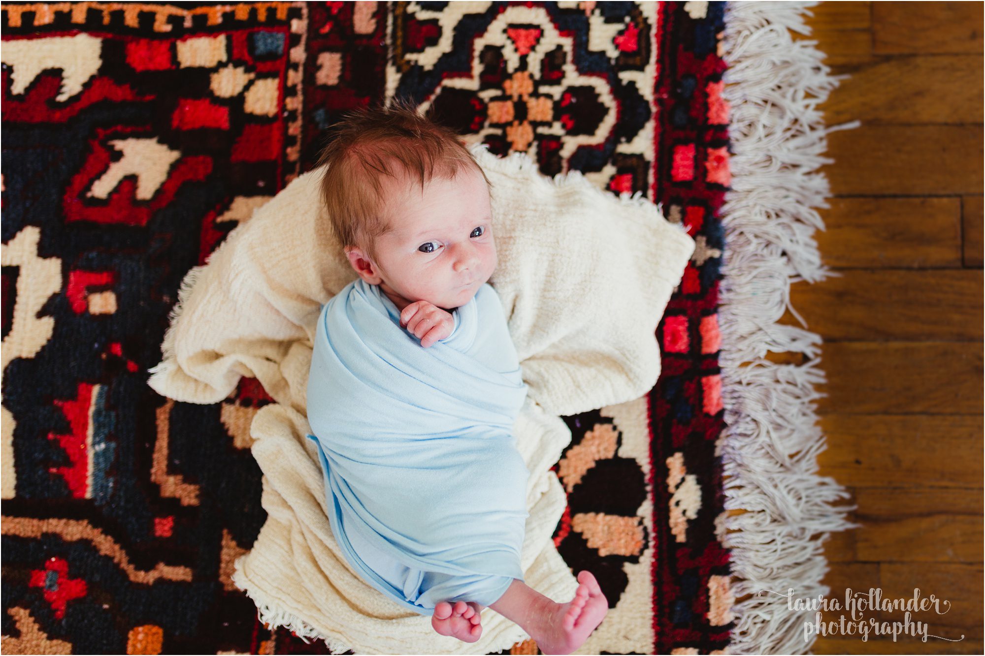 newborn boy on persian rug